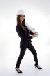 stylist female architect standing with blue prints