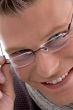 portrait of smiling young male wearing eyewear