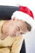 close up of male in christmas hat