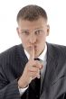businessman asking to keep silent