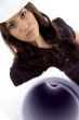 female architect with helmet and showing blueprint