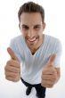 young man showing thumbs up gesture