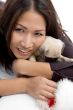 smiling female with christmas hat and puppy