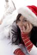 smiling beautiful woman wearing christmas hat