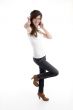 standing woman with cell phone wishing good luck