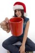 sitting woman showing coffee mug