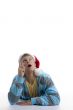 man pointing upward and wearing christmas hat