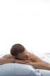 weary man sleeping in bed