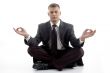 handsome young executive practicing yoga
