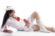 sexy pose of pretty model wearing christmas hat