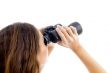 female watching through binocular