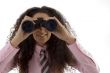 young corporate woman viewing through binoculars