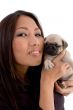 smiling woman holding puppy