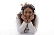 young female lying and enjoying music