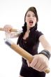 attractive young female holding nunchaku