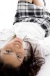 young girl lying and looking at camera