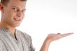 smiling man with open palm