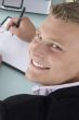 back pose of smiling man with pen and writing