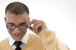 young student adjusting his spectacles
