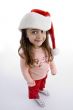 standing little girl with christmas hat