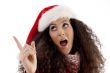 young woman with christmas hat pointing aside
