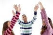 portrait of friends with raised arms
