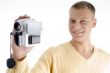 portrait of blonde man with handy cam