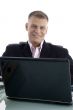 smiling young businessman with laptop
