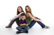 young kid sitting with teenagers
