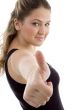 side view of smiling girl showing thumb up