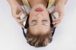 laying woman with headphone