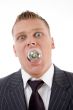 young caucasian holding electric bulb in his mouth