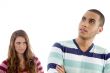 angered young girl looking to guy