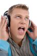 man listening through headphone