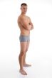 side view of muscular man with crossed arms