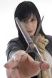 female barber holding scissors