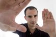 smart pose of young guy with open palms