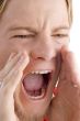 face of male shouting loudly