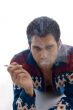 laying male holding cigarette