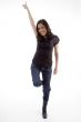 standing happy young woman pointing up