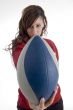 woman holding football