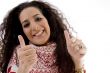 young woman showing thumb up with both hands