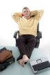 male in relaxing mode with legs on desk