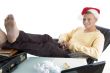 smiling man wearing christmas hat