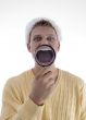 man weaing santa hat and showing lens