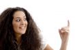 close up view of beautiful woman pointing upwards