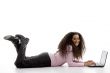 young hispanic female busy working on laptop