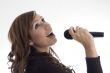 woman singing in microphone