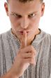 man instructing you to be silent