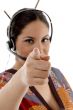 female wearing headphone pointing at camera
